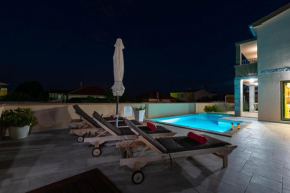 New elegant villa with pool close to the beach